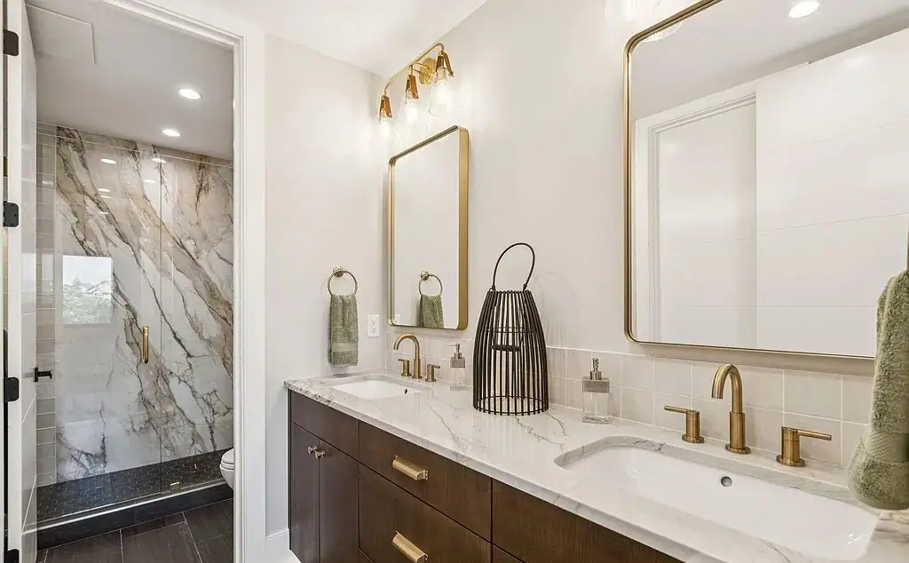 Luxury marble and brass bathroom in Park City home