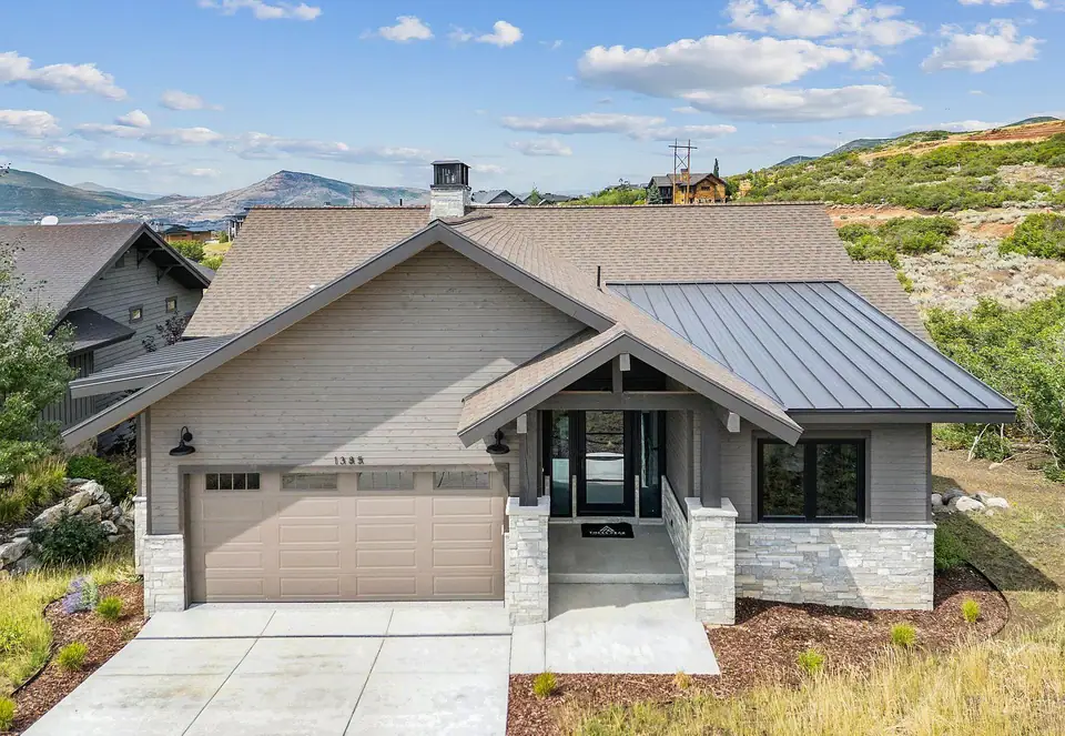 Completed $2.945M Park City Parade of Homes custom home, mountain modern exterior with stone, wood, and metal