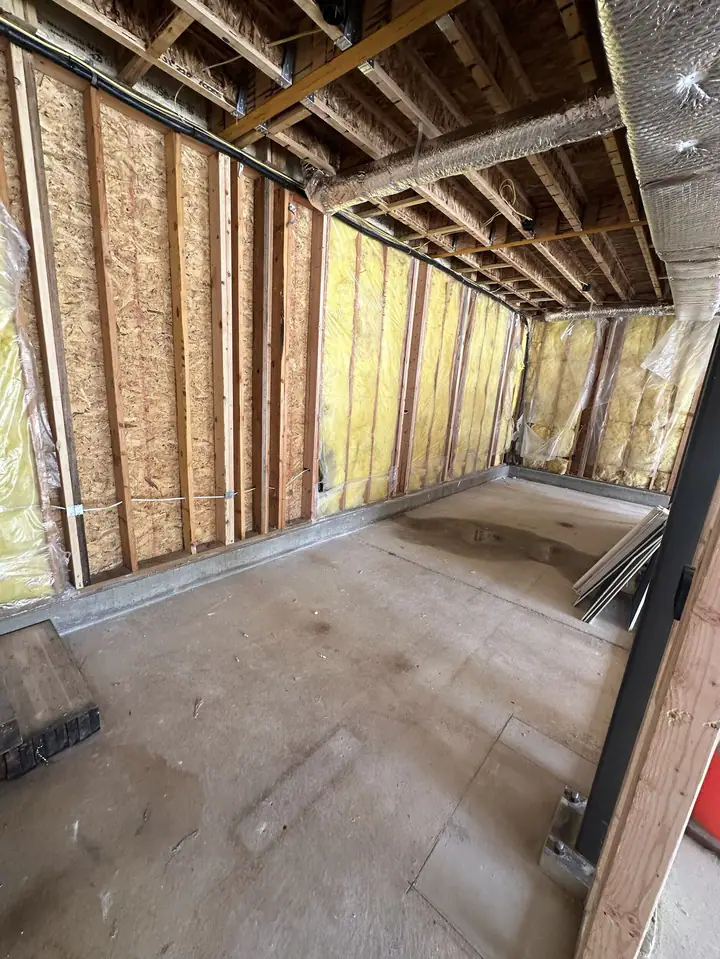 Framed and insulated bedroom inside the addition