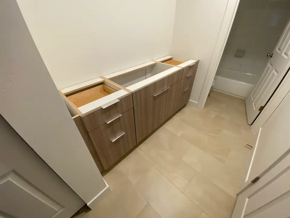 New bathroom vanities set in a Park City condo before the counters go on